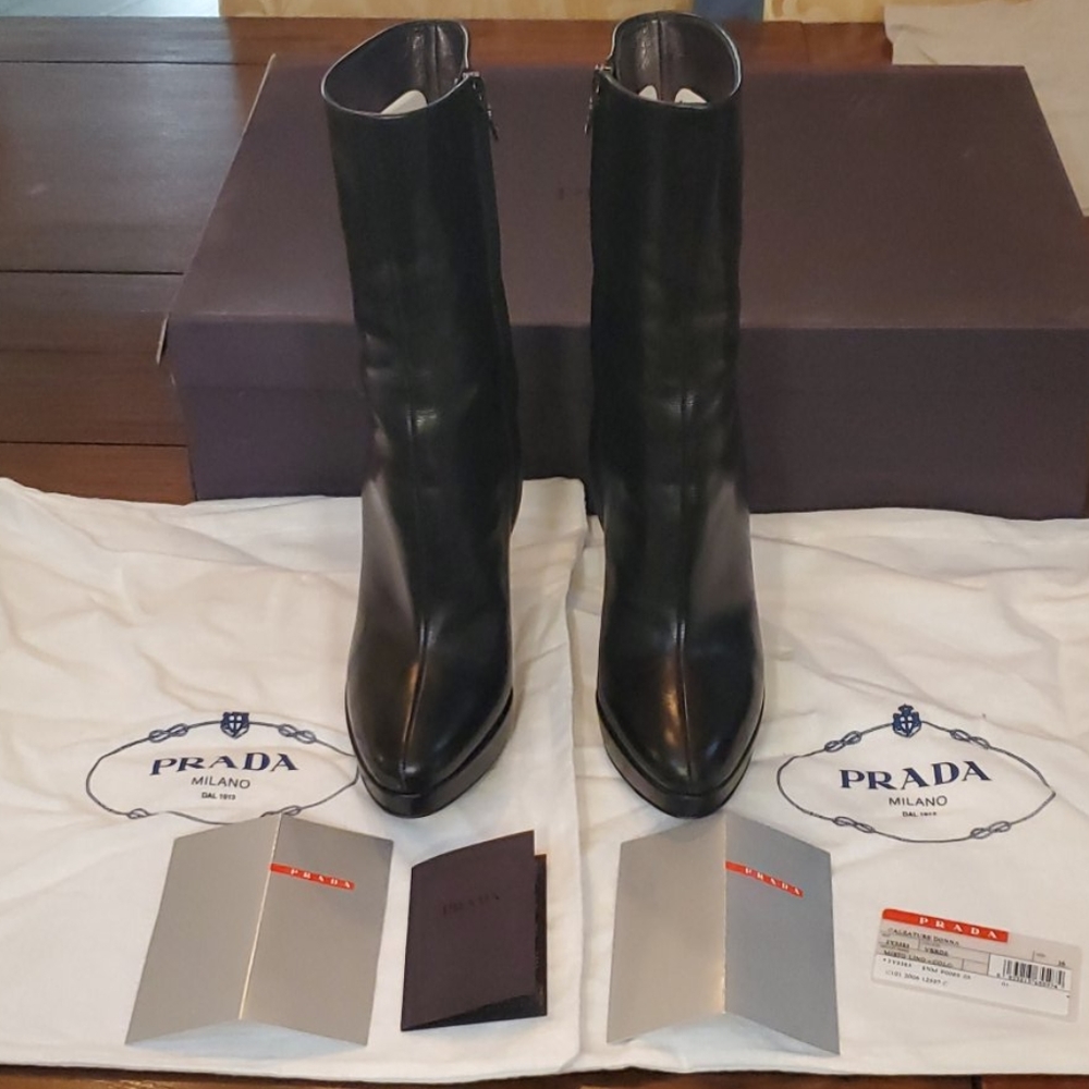 PRADA Black leather platform midi boots.